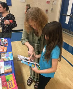 Swanton public library girl with book